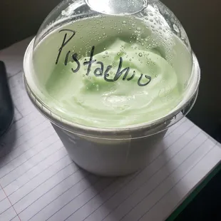 a cup of green yogurt