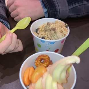 two people eating yogurt