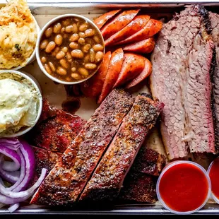 a platter of meat and beans