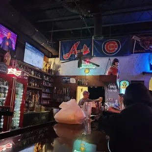 a bar with neon signs