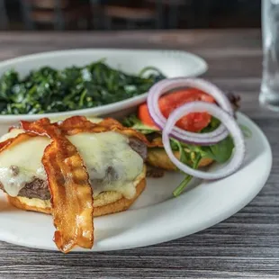 Bacon &amp; Swiss burger with sautéed spinach