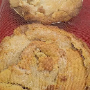 two pies wrapped in plastic