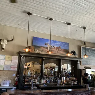 a bar with a cow skull on the wall