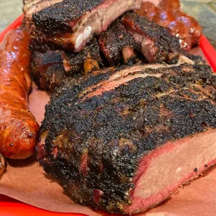 Beef Brisket, Ribs, Jalapeno-Cheddar Sausage and Garlic Confit Sausage