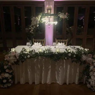 Keani and Sly decorated the sweethearts table, assembled and decorated the arch. They also hung our neon sign