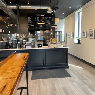 a coffee shop with a wooden counter