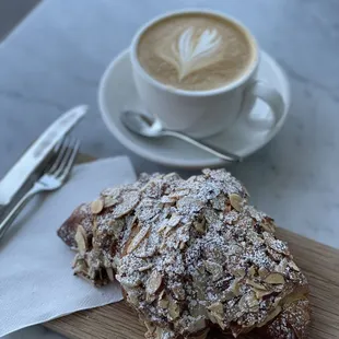 a pastry and a cup of coffee