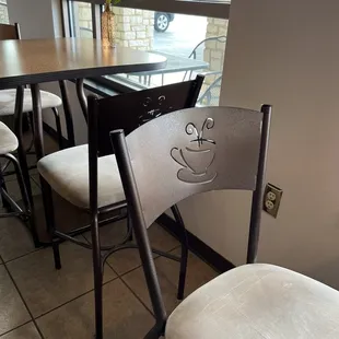 a smiley face drawn on the back of a chair