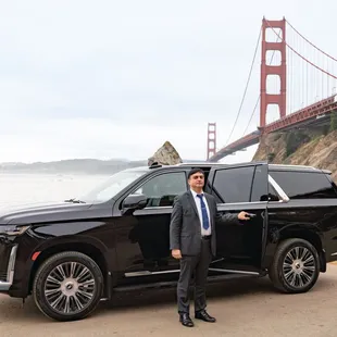Chauffeur by his car