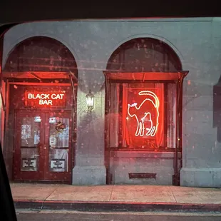 a neon sign on the side of a building