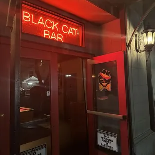 a neon sign on the door