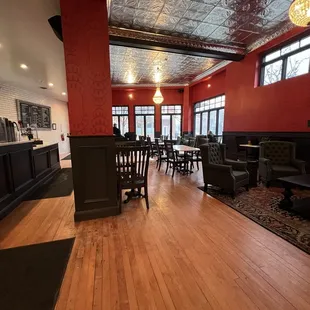 a wood floor and red walls