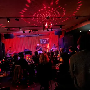 a group of people in a dimly lit room