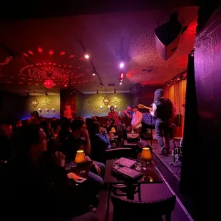 a group of people in a dimly lit room