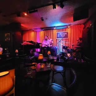 a band playing in a dimly lit room