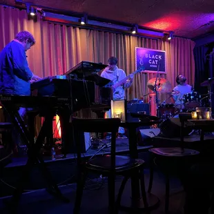 a band playing in a dimly lit room