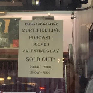 a sign in a shop window