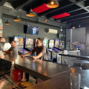 a group of people sitting at a bar