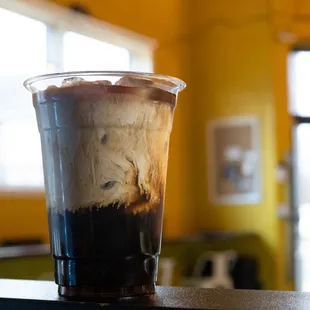 a cold beverage in a plastic cup