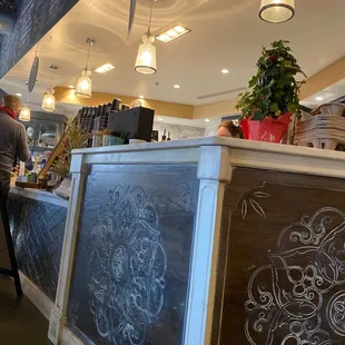a woman standing at a counter