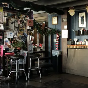 In front of coffee stand, local business and events board