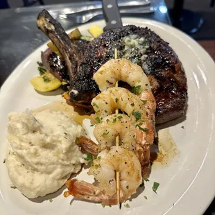 Cowboy steak with shrimp and mashed potatoes