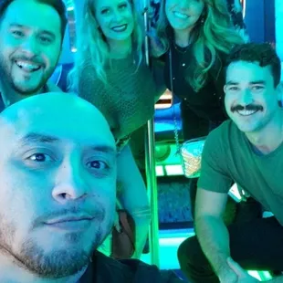 View from inside the party bus. Flat screens and neon lights everywhere.