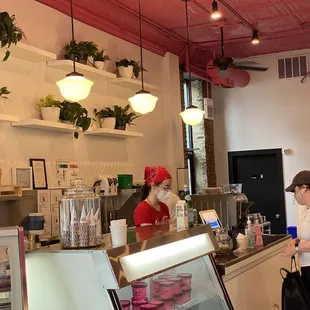 a woman behind the counter