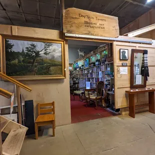 a dog sitting in the doorway of a store