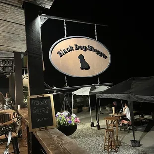 a black dog social club and shoppe