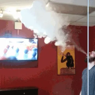Jesse blowing clouds in the Black Dog Vapes Lounge