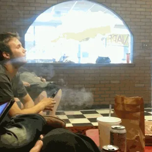 Folks lounging/vaping at Black Dog Vapes