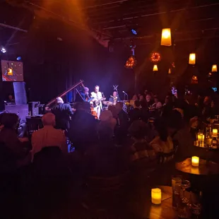 a band performing in a dimly lit room