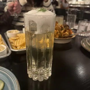 Anethus cocktail  Aquavit, dill, oolong tea, vegan milk clarification, CO2, coconut foam