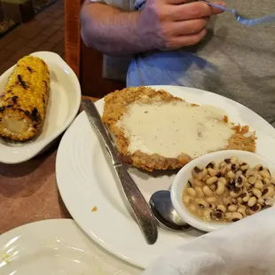 Chicken fried steak with black-eyed pees and corn