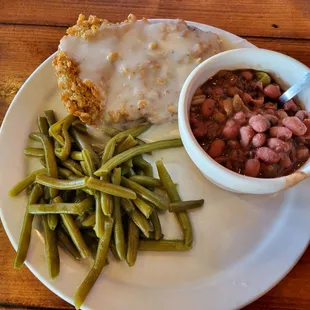 Chicken fried steak with green beans and red beans and rice.  $12.99
