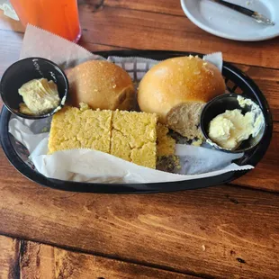 Complimentary cornbread and rolls with butter