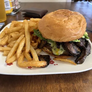 Elk Burger with added Spicy Bacon and Grilled Mushrooms Amazing French Fries