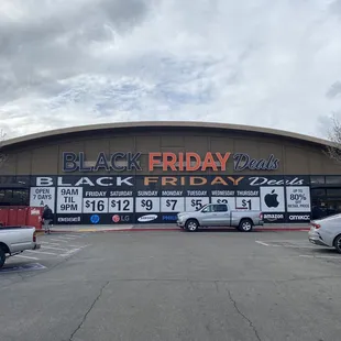 Front of store. You can see what the prices are on what day. New shipments arrive on Fridays.