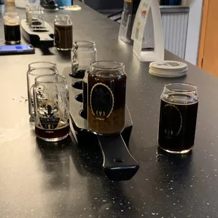 a row of beer mugs on a counter