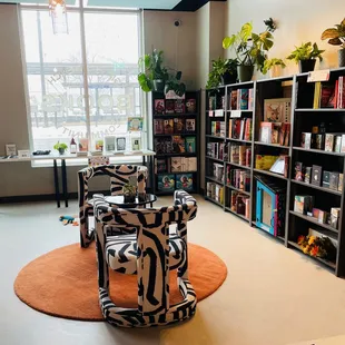 Love the furniture, decor, plants &amp; natural light in this bookstore