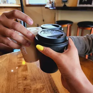 a person holding a cup of coffee