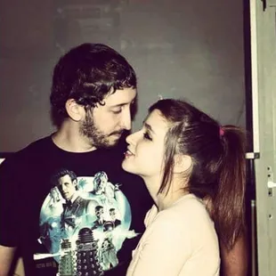 a man and a woman sharing a kiss