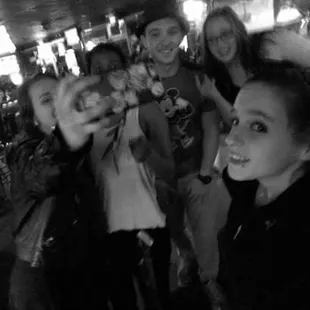 a group of people taking a selfie