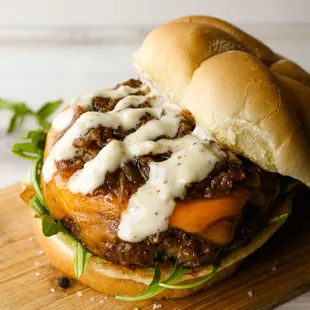 a beef sandwich with cheese and lettuce