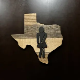 Women&apos;s bathroom sign