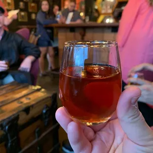 a person holding a wine glass