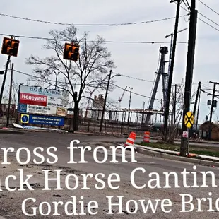 a street with traffic lights and construction cones