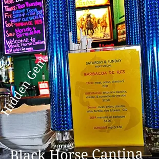 a sign for the black horse cantina in delray