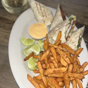 Fish tacos (yes it looks like a burrito lol) with sweet potato fries &amp; a glass of pinōt grigio.